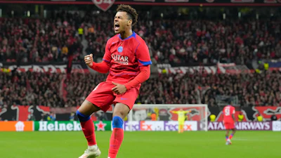 PSG's Desire Doue celebrates after scoring his side's second goal during a Champions League match between Bayer Leverkusen and Paris Saint-Germain, Leverkusen, Germany, Oct. 21, 2025.