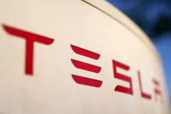 The logo for the Tesla Supercharger station is seen in Buford, Ga, April 22, 2021.