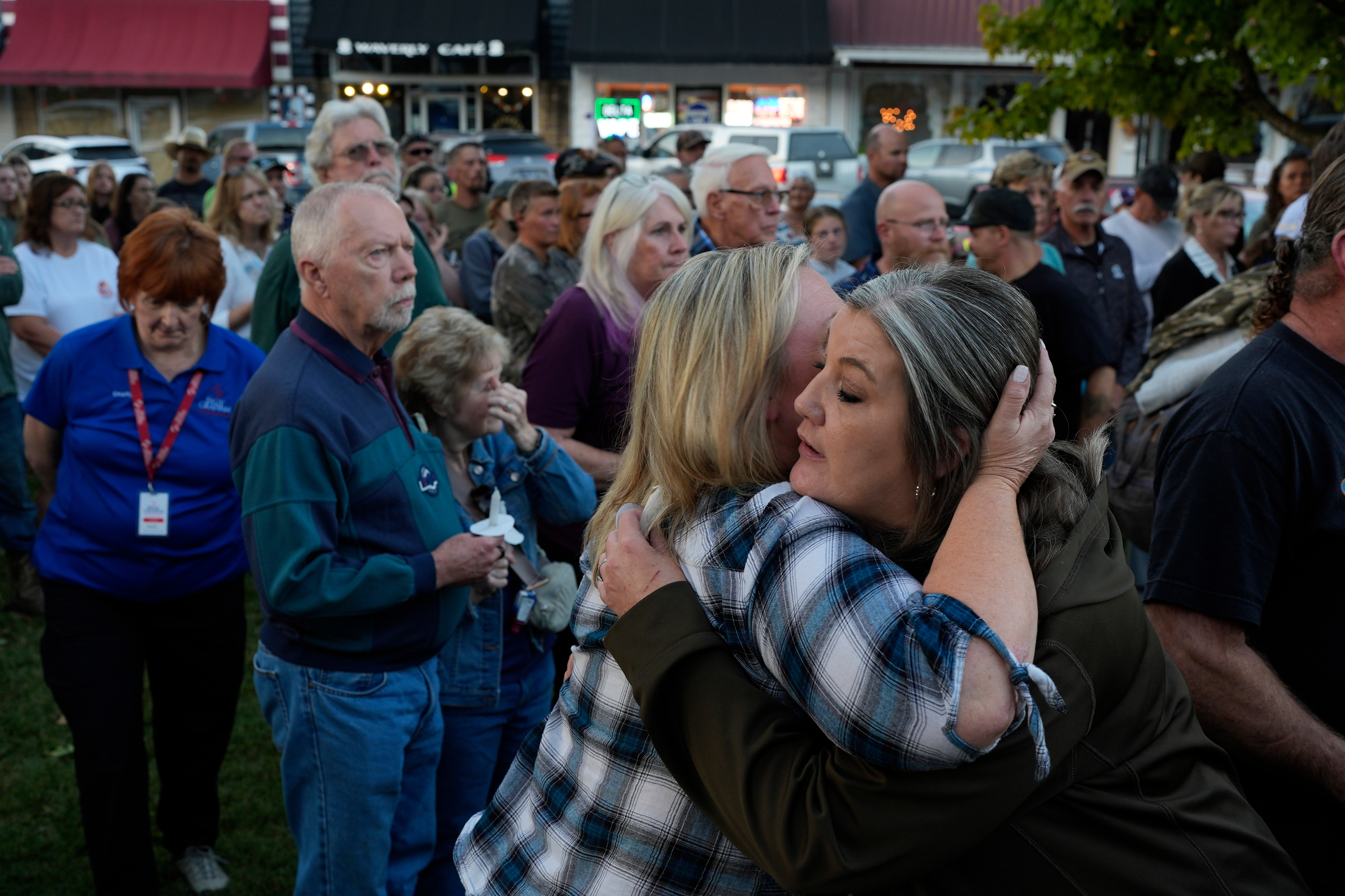 Christina Williams, right, hugs Tracy Cook during a candlelight vigil honoring the victims of a blast at an explosives plant, Accurate Energetic Systems, Sunday, Oct. 12, 2025, in Waverly, Tenn.
