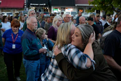 Christina Williams, right, hugs Tracy Cook during a candlelight vigil honoring the victims of a blast at an explosives plant, Accurate Energetic Systems, Sunday, Oct. 12, 2025, in Waverly, Tenn.