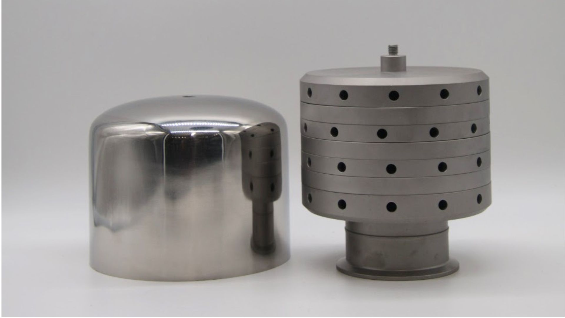 Two metallic cylindrical industrial components with different surface textures