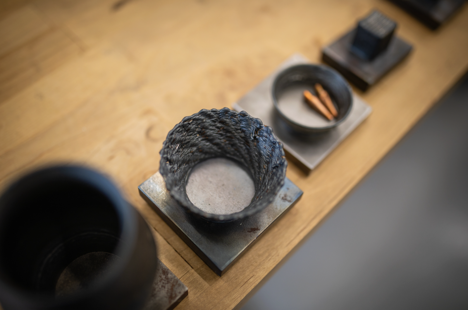 Wire-arc additive manufacturing processes can make large parts, but sometimes they aren't printed perfectly, like the dish in the center. Rao's lab works on monitoring the process and taking corrective action to ensure parts are printed correctly the first time.