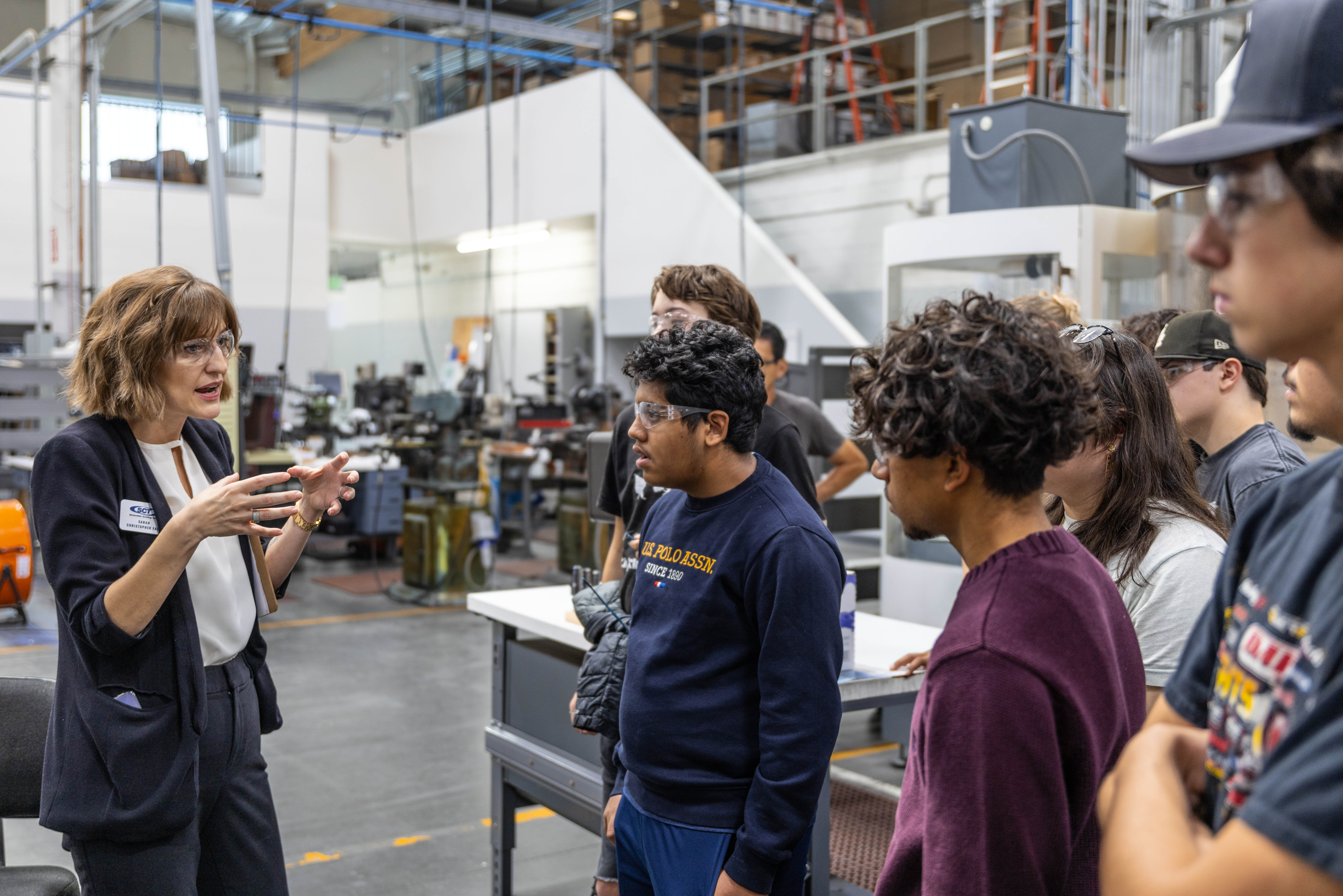 Scientific Cutting Tool's Sarah Christopher Falk speaks to a group of students.