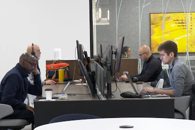 In this image taken from video, employees work in Ford Motor Co.'s new headquarters building, Monday, Nov. 10, 2025, in Dearborn, Mich.