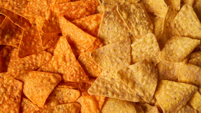 This image provided by PepsiCo shows, from left, original Doritos Nacho cheese chips next to new Doritos without artificial colors or flavors.
