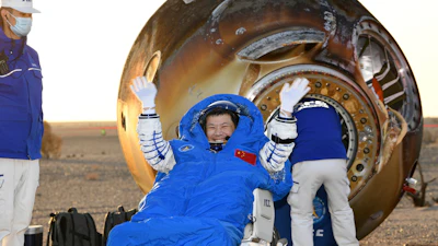 In this photo released by Xinhua News Agency, Wang Jie, a Shenzhou-20 astronaut, returns on the Shenzhou-21 spaceship's return capsule after it touched down on Earth at the Dongfeng landing site in north China's Inner Mongolia Autonomous Region, Friday, Nov. 14, 2025.