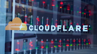 Lava lamps are seen through a lobby window at the headquarters of Cloudflare in San Francisco, Wednesday, Aug. 31, 2022.