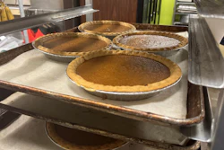 Pies, fresh out of the oven, cool on a baking rack on Friday, Nov. 21, 2025, in Flowood, Miss.