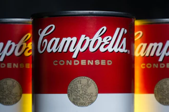 Campbell's Condensed Soup can with vintage commemorative medallion