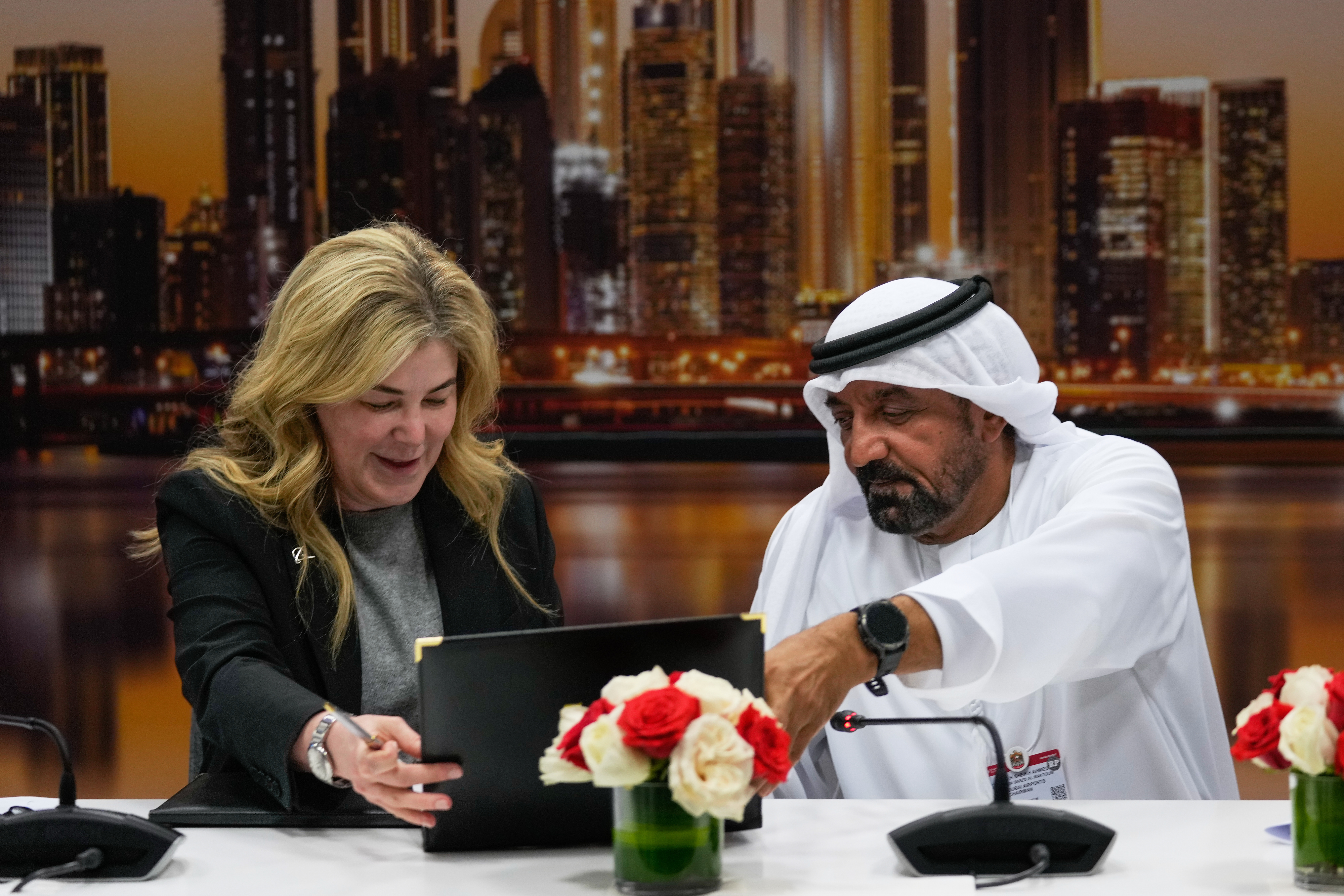 Stephanie Pope, President and CEO of Boeing Commercial Airplanes, left, and Sheikh Ahmed bin Saeed Al Maktoum, President, Dubai Civil Aviation Authority and Chairman of Emirates airlines, sign an agreement to order 65 additional Boeing 777X aircrafts during a press conference on the opening day of the Dubai Air Show, United Arab Emirates, Monday, Nov. 17, 2025.