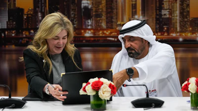 Stephanie Pope, President and CEO of Boeing Commercial Airplanes, left, and Sheikh Ahmed bin Saeed Al Maktoum, President, Dubai Civil Aviation Authority and Chairman of Emirates airlines, sign an agreement to order 65 additional Boeing 777X aircrafts during a press conference on the opening day of the Dubai Air Show, United Arab Emirates, Monday, Nov. 17, 2025.