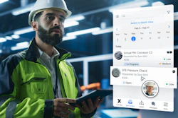 Industrial worker using tablet with project management app.