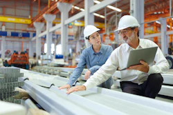 Manufacturing production planners on the factory floor.