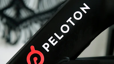 The Peloton logo is seen on the company's stationary bicycle in San Francisco, Calif., Nov. 19, 2019.