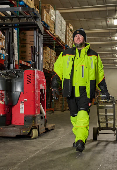 An order selector stays warmer and works more productively in the freezer with high-visibility freezer bibs, freezer jacket, thermal base layers, freezer gloves and safety toe freezer boots.