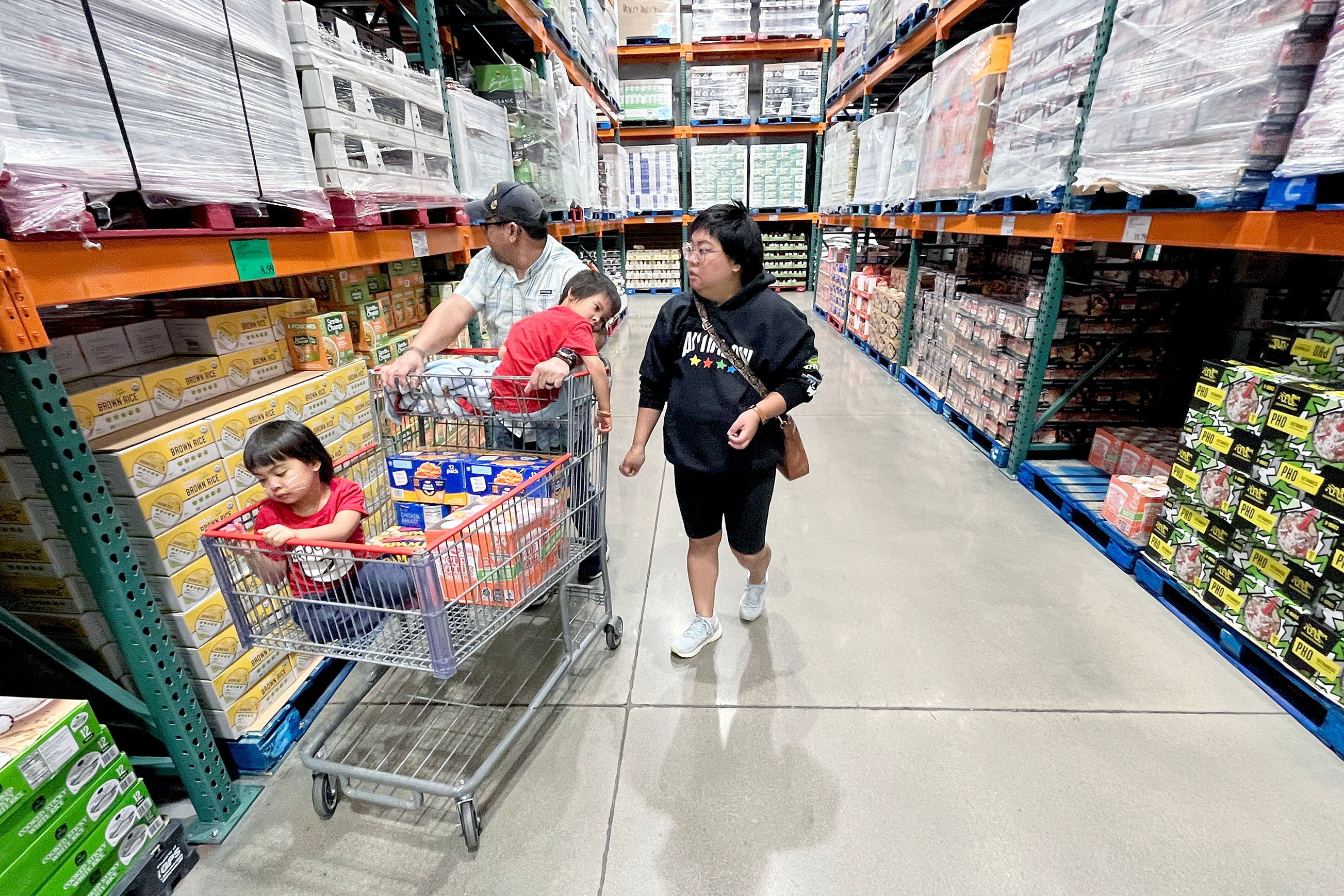 KC Neufeld, right, shops with her family in Englewood, Colo., Oct. 29, 2025.