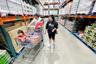 KC Neufeld, right, shops with her family in Englewood, Colo., Oct. 29, 2025.