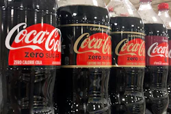 Bottles of Coca-Cola products sit on a shelf at a store in Dania Beach, Fla., Oct. 20, 2020.
