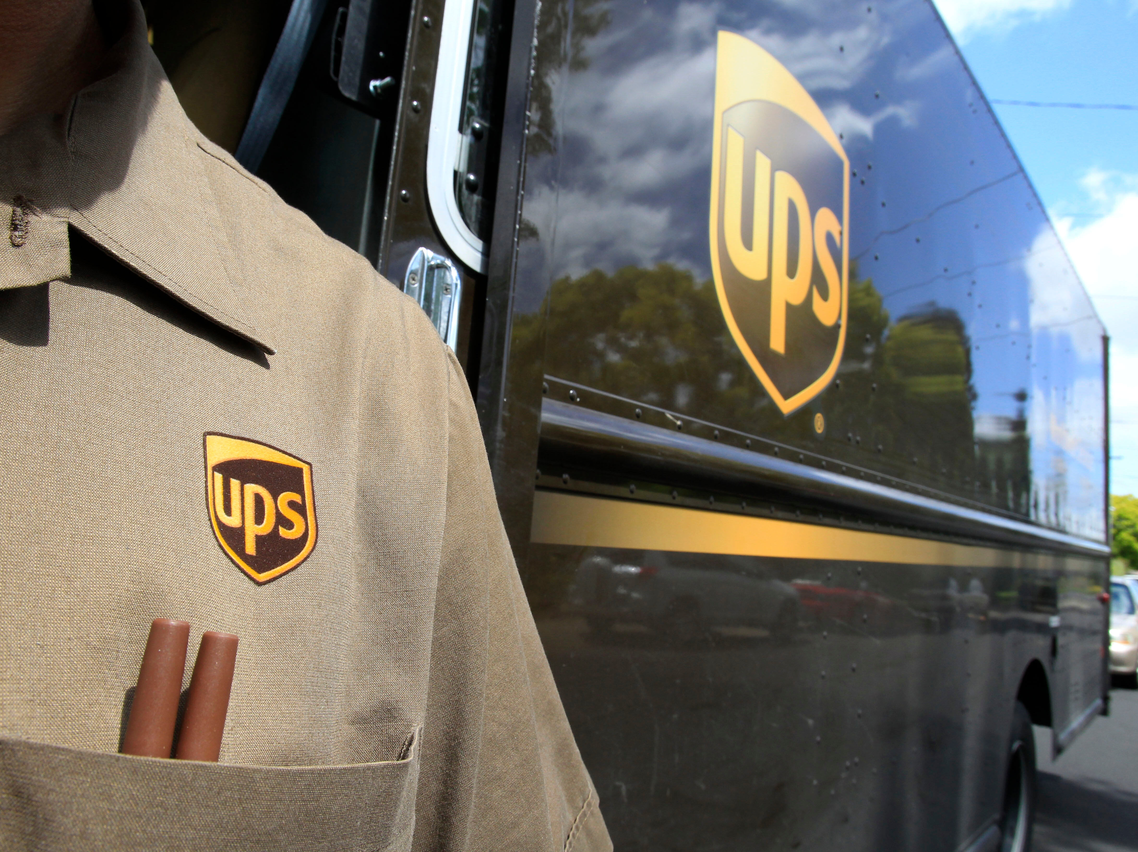 An April 25, 2011, file photo shows United Parcel Service driver Albert Palafox in Palo Alto, Calif.