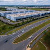 Cars drive past data centers that house computer servers and hardware required to support modern internet use, such as artificial intelligence, in Ashburn, Virginia, July 16, 2023.