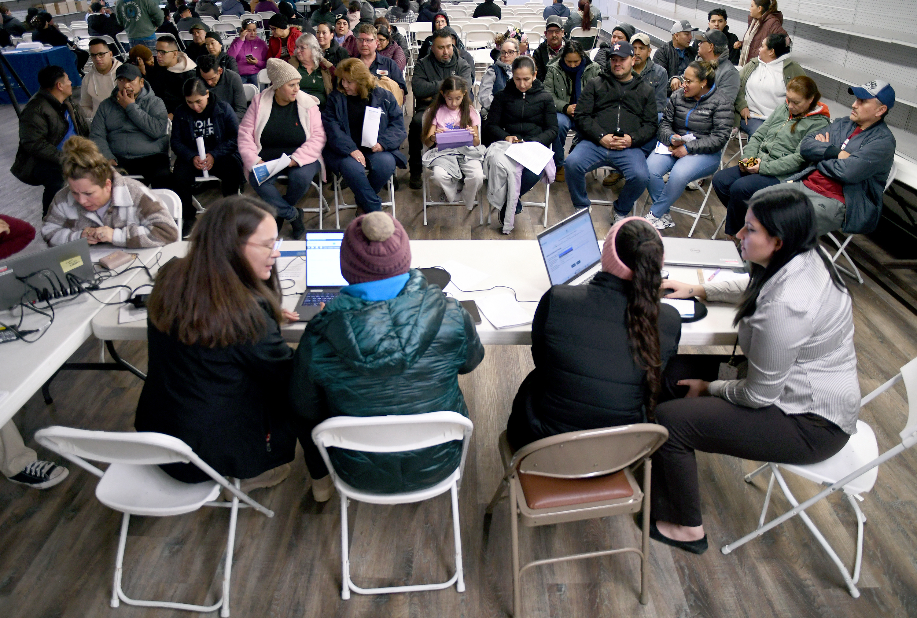 Tyson Foods employees at an informational meeting held by the Nebraska Department of Labor in Lexington, Neb., Dec. 3, 2025.