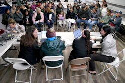 Tyson Foods employees at an informational meeting held by the Nebraska Department of Labor in Lexington, Neb., Dec. 3, 2025.