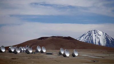 Radio antennas are spread out on the terrain as part of one of the world's largest astronomy projects, the Atacama Large Millimeter/submillimeter Array (ALMA) in Chajnator in the Atacama desert in northern Chile, Sept. 27, 2012.