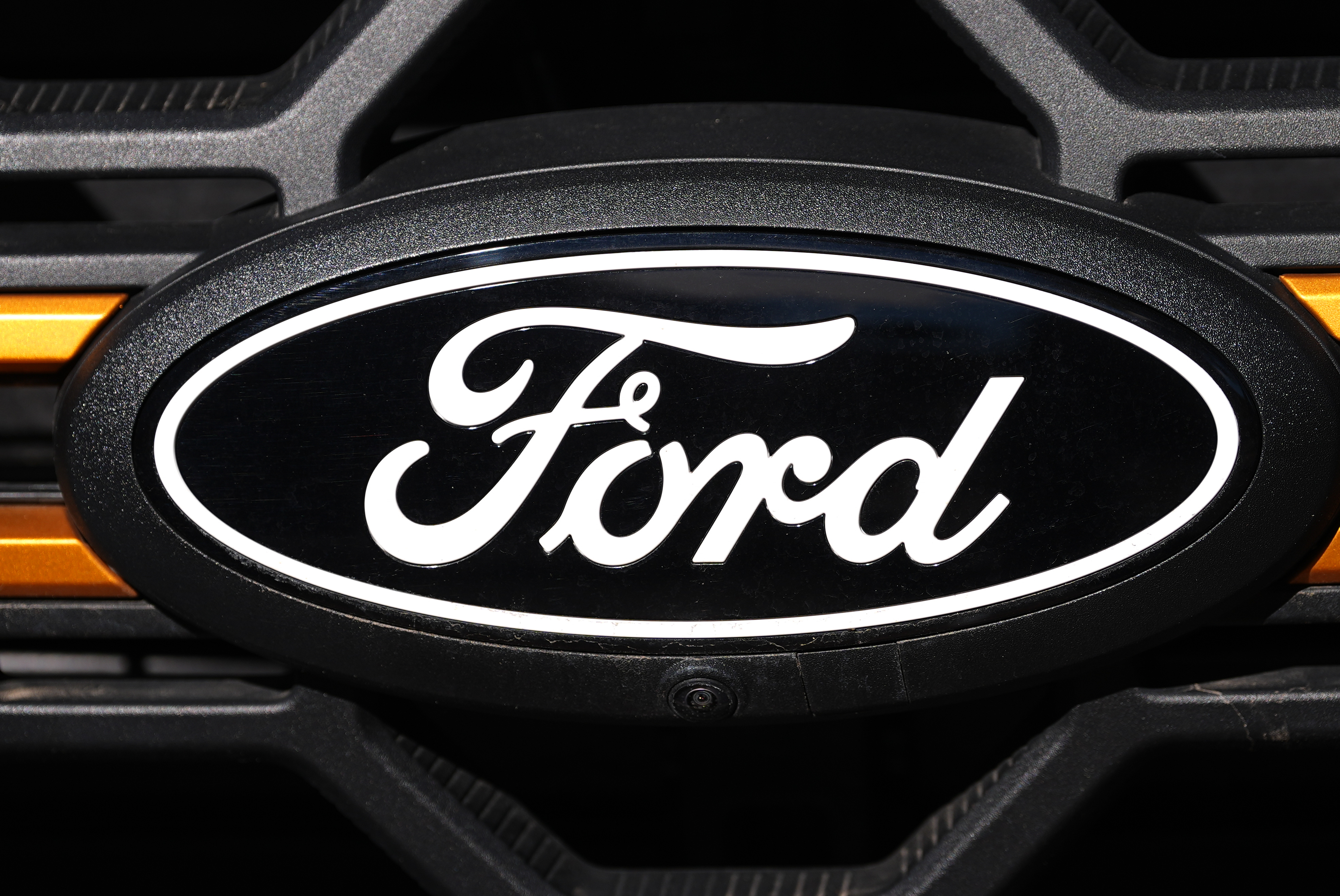 The company logo is shown on the grille of an unsold 2026 F-series pickup truck on the lot of a Ford dealership, Sunday, Nov. 2, 2025, in Littleton, Colo.