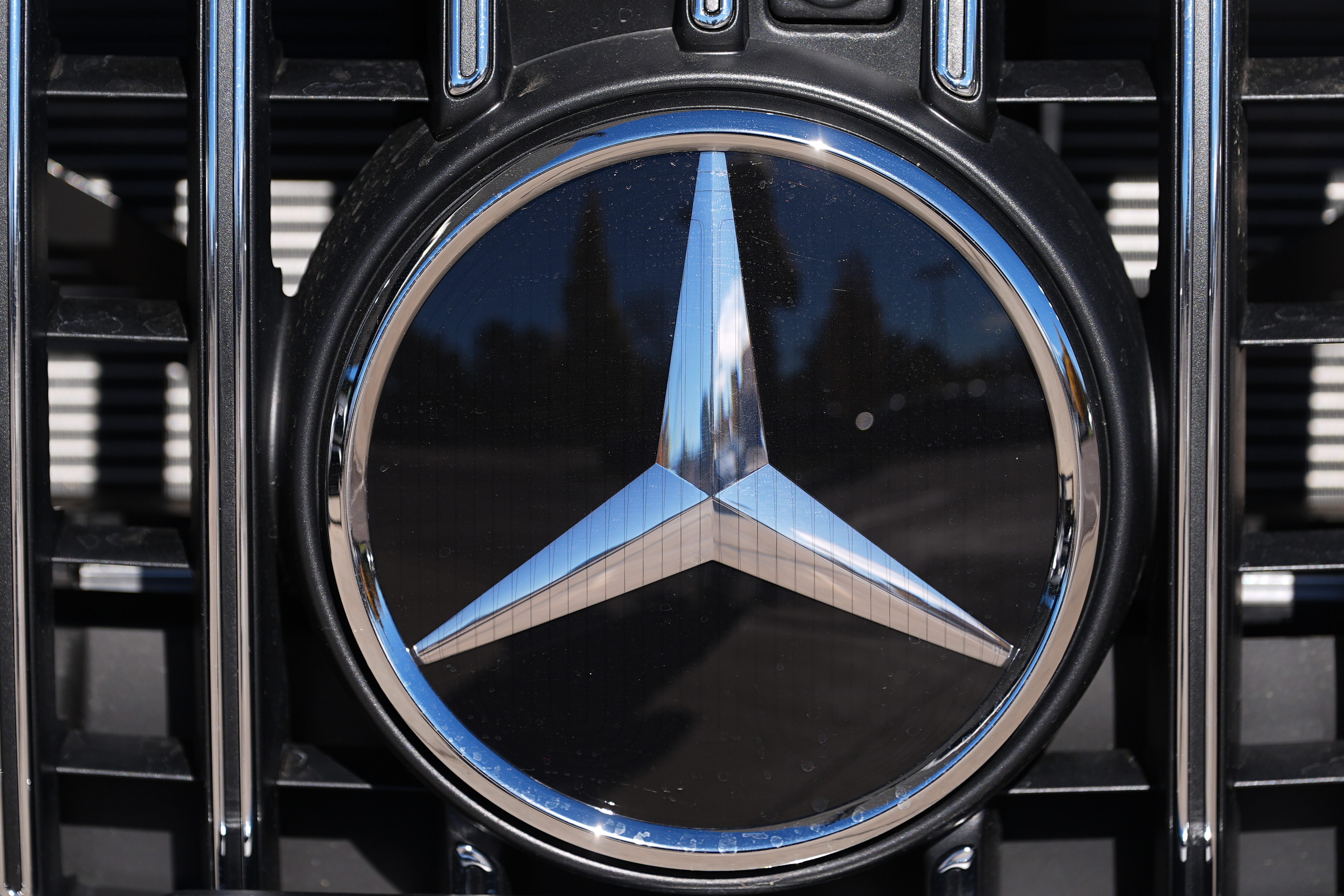 The company logo is shown on the grille of an unsold 2026 AMG S63 Performance model on the lot of a Mercedes Benz dealership Nov. 2, 2025, in Littleton, Colo.