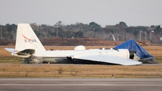 A NASA aircraft sits near a runway at Ellington Airport after making a belly landing on Tuesday, Jan. 27, 2026, in Houston.