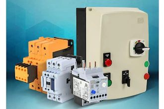 Electrical control panel with orange, white, and beige circuit breakers and switches
