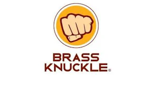 Brass Knuckle logo: Clenched fist in yellow-orange circle