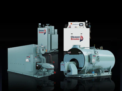 Two large industrial Cleaver Brooks boilers in blue-gray color against black background