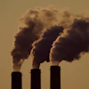 Emissions rise from the smokestacks at the Jeffrey Energy Center coal power plant as the suns sets, near Emmett, Kansas, Sept. 18, 2021.