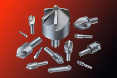 Assorted metal precision drill bits and cutting tools on red background