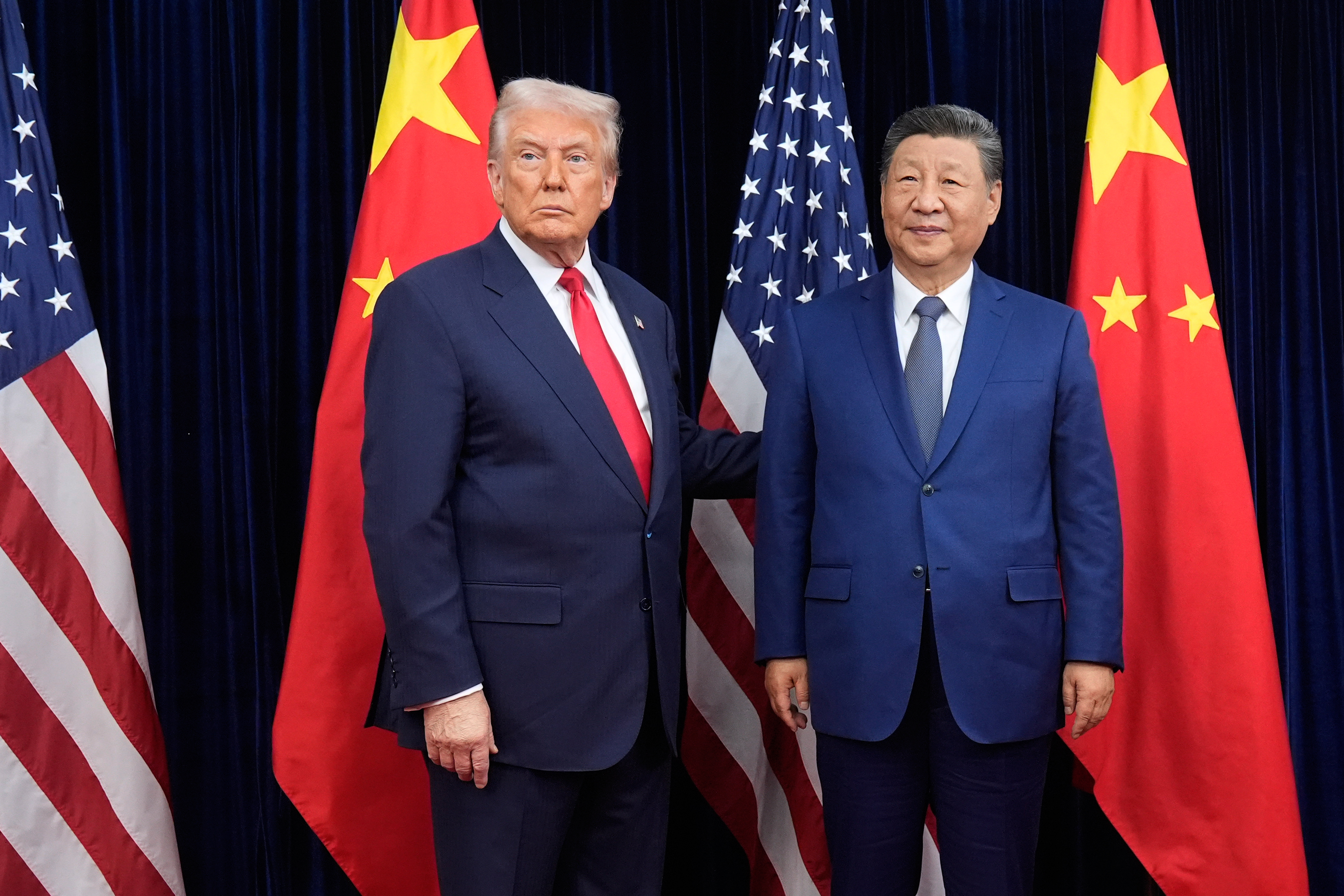 President Donald Trump and Chinese President Xi Jinping pose ahead of their summit talk at Gimhae International Airport, Busan, South Korea, Oct. 30, 2025.