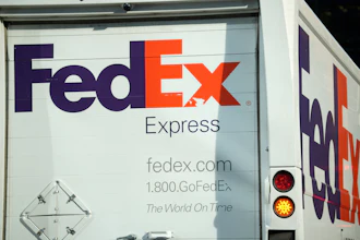 FedEx Express storefront signage with contact information and 'The World On Time' tagline