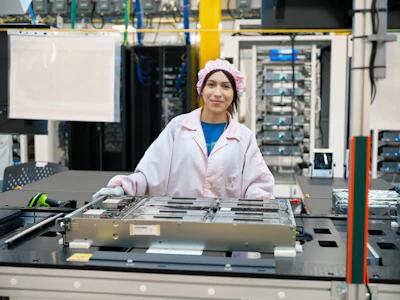 In Houston, workers assemble advanced AI servers, including logic boards produced onsite, which are then used in Apple data centers in the U.S.