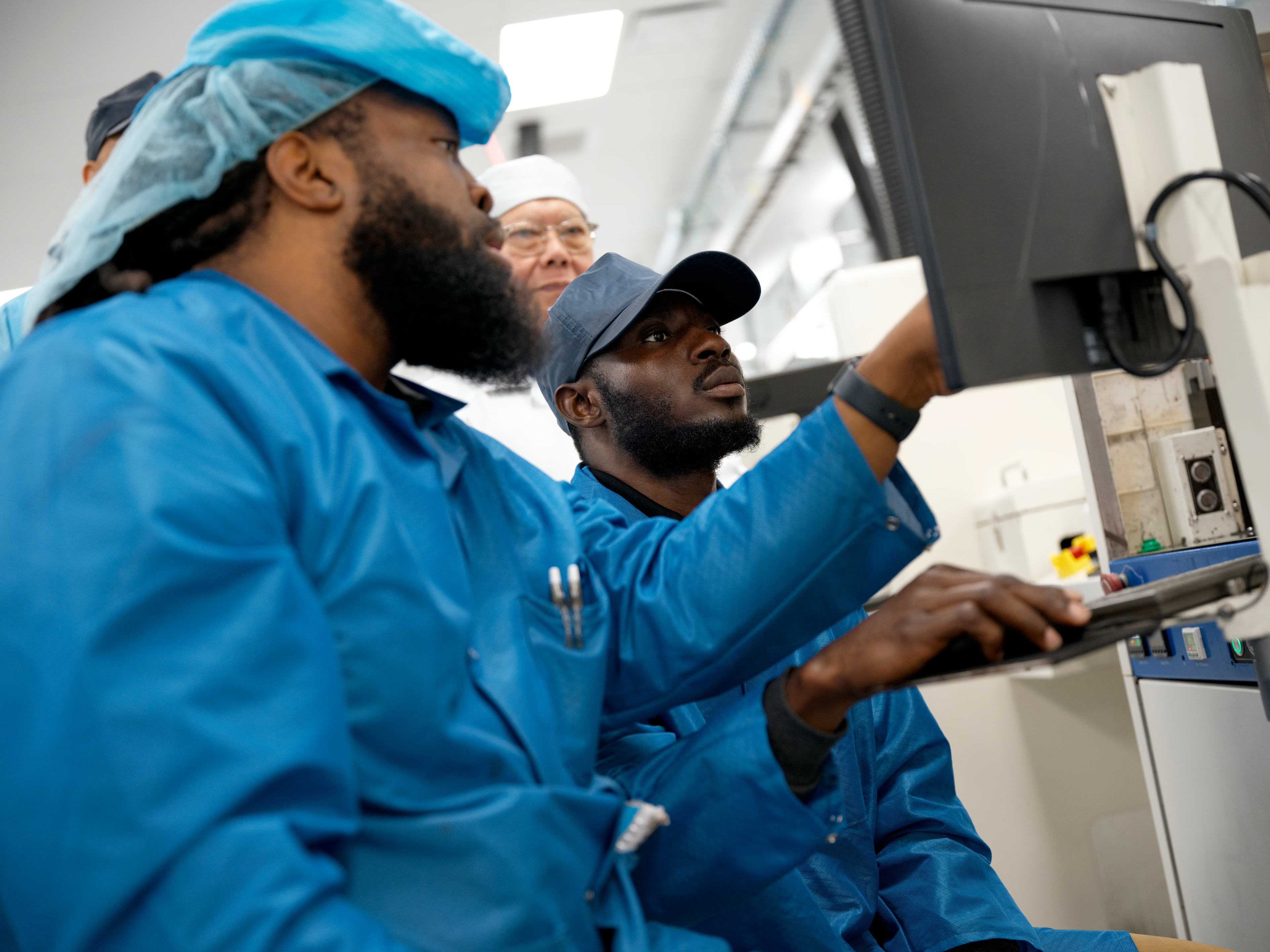 In Houston, workers assemble advanced AI servers, including logic boards produced onsite, which are then used in Apple data centers in the U.S.