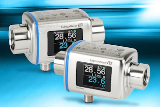 Two metallic industrial flow measurement devices with digital displays