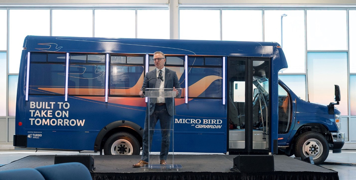 Blue Bird signed an agreement to acquire Girardin Group&rsquo;s stake in the 50/50 Micro Bird joint venture. Established in 2009, Micro Bird specializes in designing and manufacturing Type A school and commercial shuttle buses with capacities ranging from 9 to 36 passengers. Pictured here is John Wyskiel, president and CEO of Blue Bird Corporation, at the Sept. 2025 grand opening of the Micro Bird manufacturing facility in Plattsburgh, N.Y.