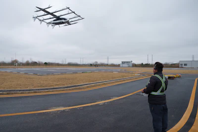 A pilot monitors the landing of a 5-ton class eVTOL aircraft at AutoFlight flight testing field in Shanghai, China, on Feb. 24, 2026.