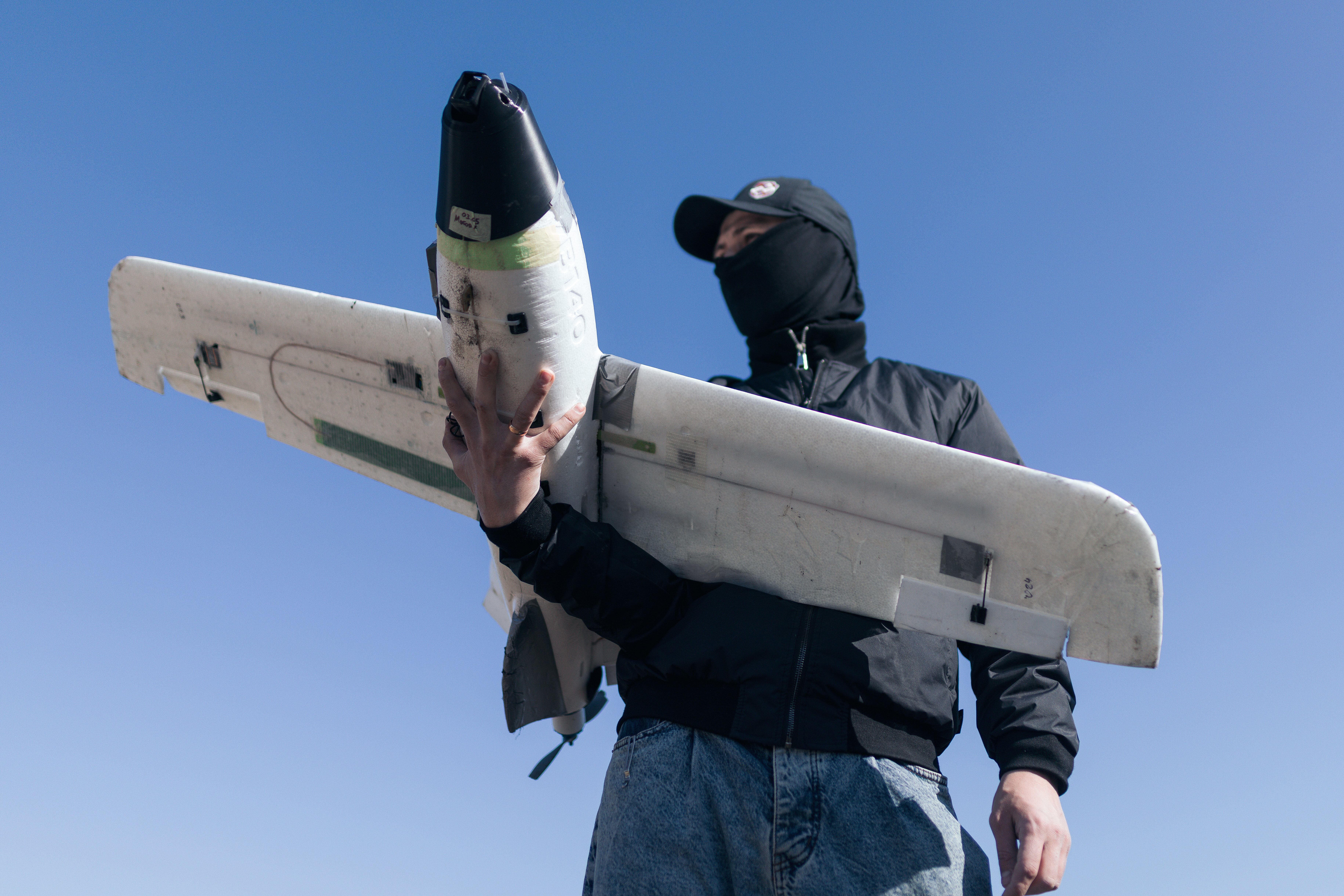 A soldier of the 127th Separate Territorial Brigade launches a drone to search for Russian attack drones at the front line in the Kharkiv region Friday, March 13, 2026.