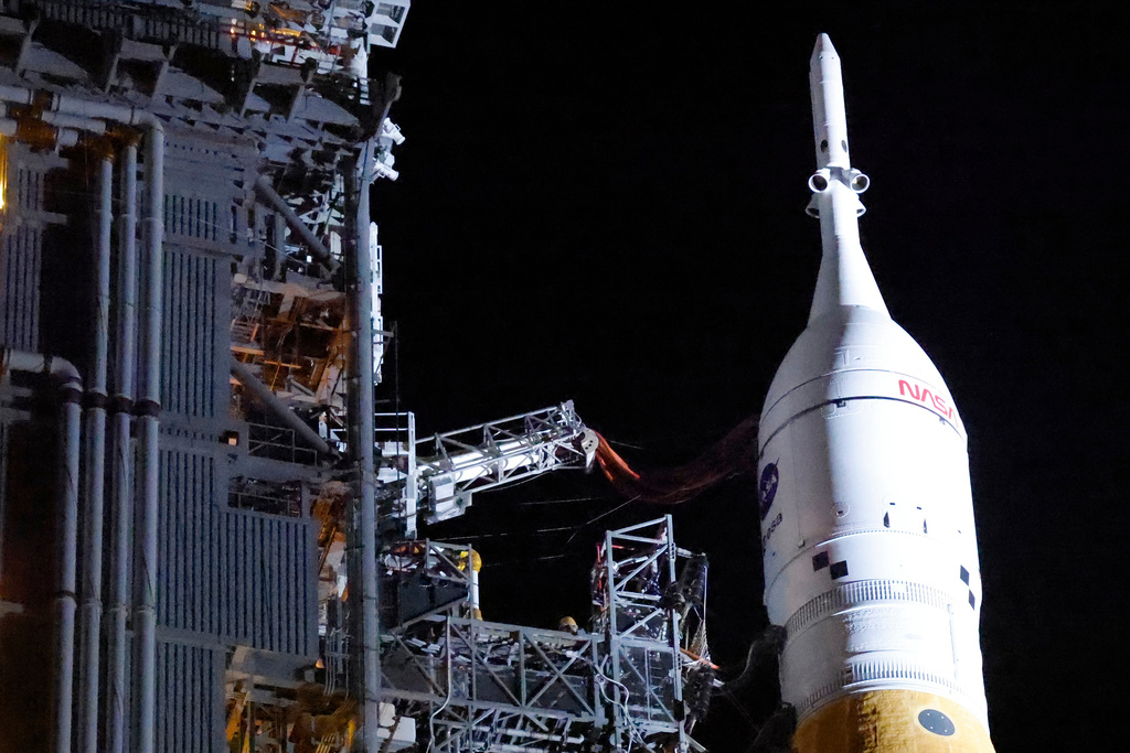 The NASA Artemis II rocket with the Orion spacecraft aboard leaves the Vehicle Assembly Building moving slowly to pad 39B at the Kennedy Space Center in Cape Canaveral, Fla., Friday, March 20, 2026.