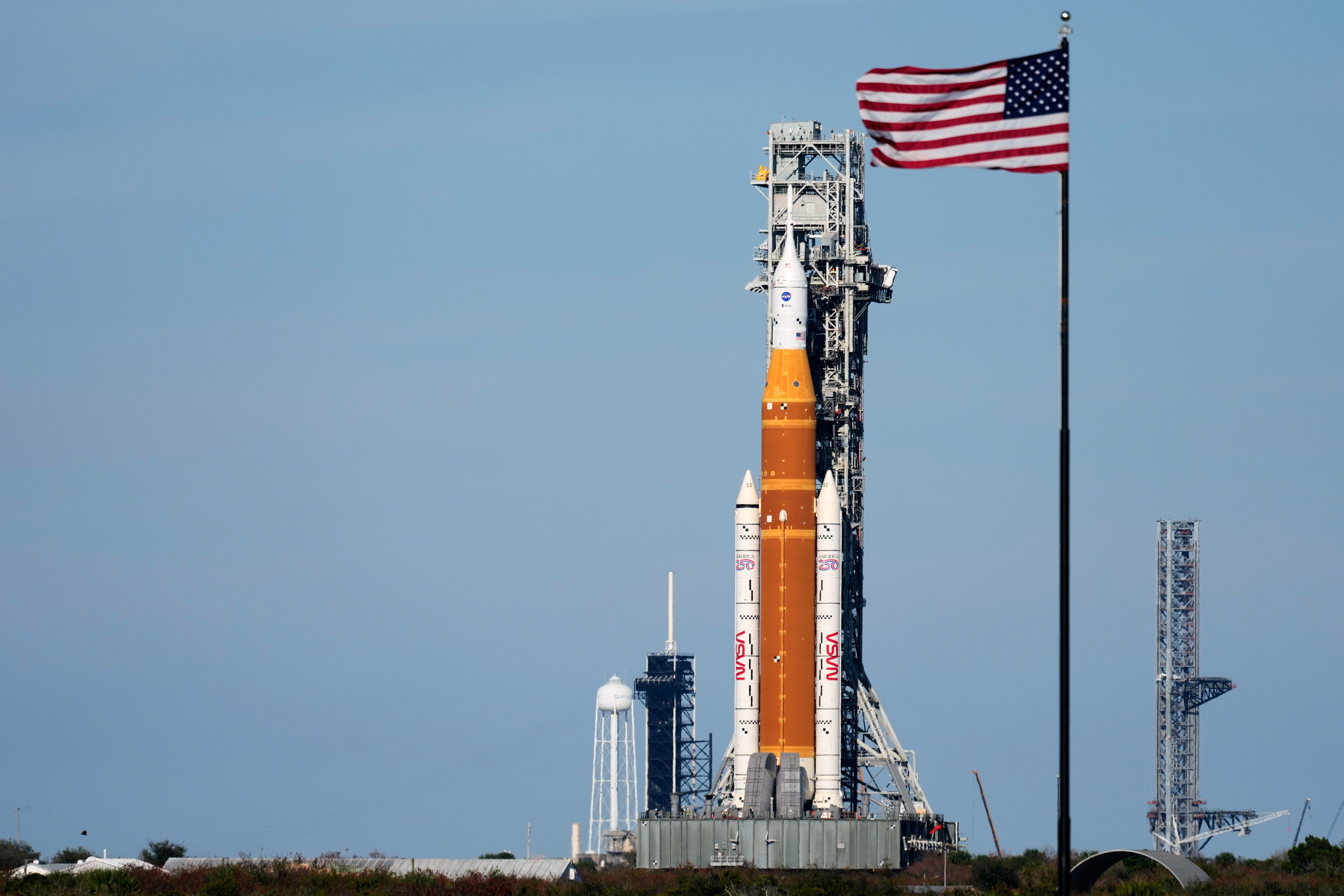 NASA's Artemis II SLS (Space Launch System) moon rocket with the Orion spacecraft slowly rolls back towards the Vehicle Assembly Building at the Kennedy Space Center, Feb. 25, 2026, in Cape Canaveral, Fla.