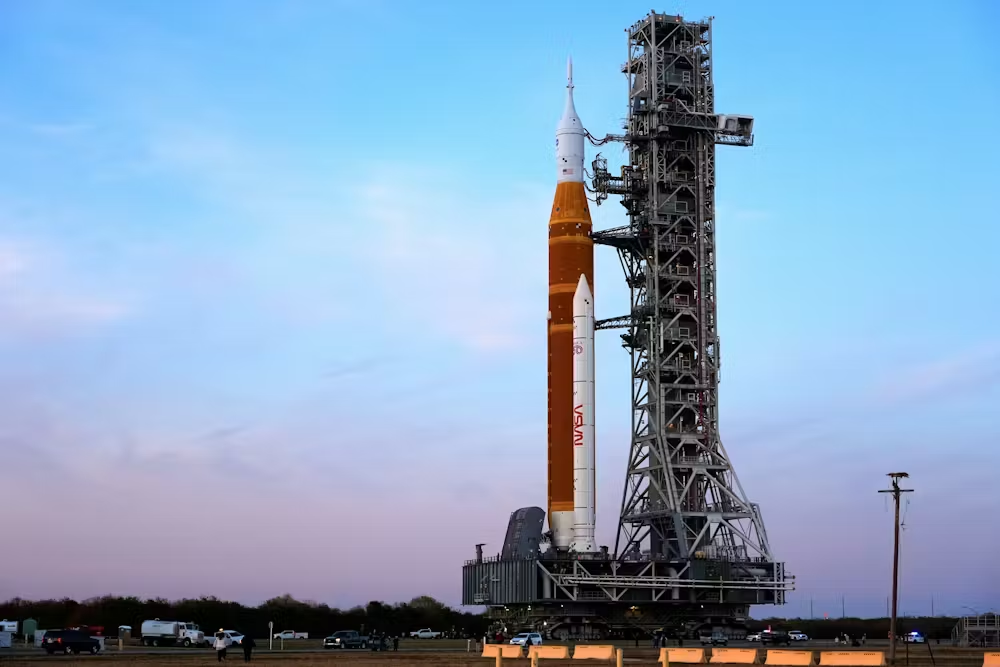 NASA&rsquo;s Artemis II SLS Moon rocket, along with the Orion spacecraft, slowly rolls back toward the vehicle assembly building at the Kennedy Space Center on Feb. 25, 2026.
