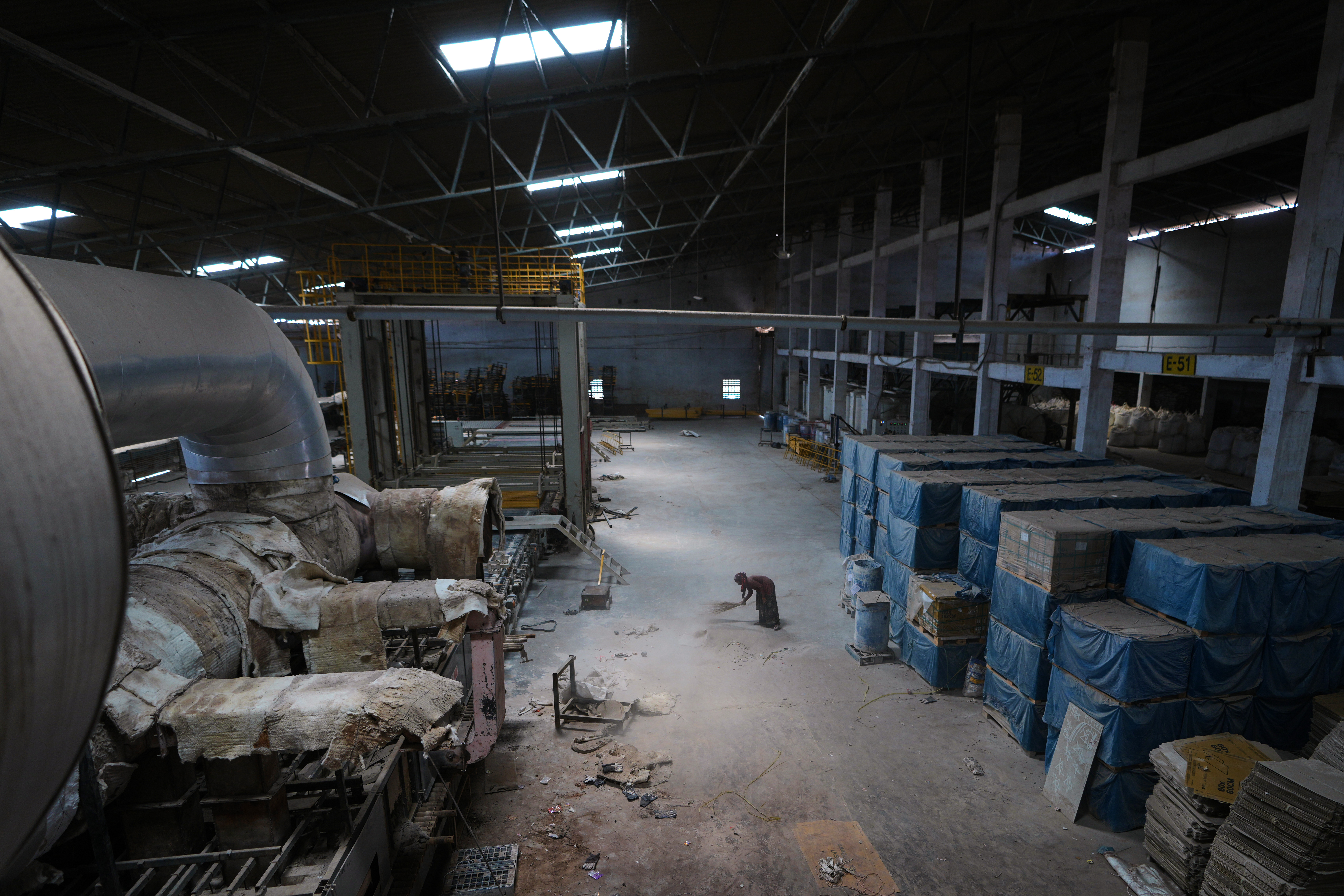 Photos: War Shuts Down Tile Maker in India