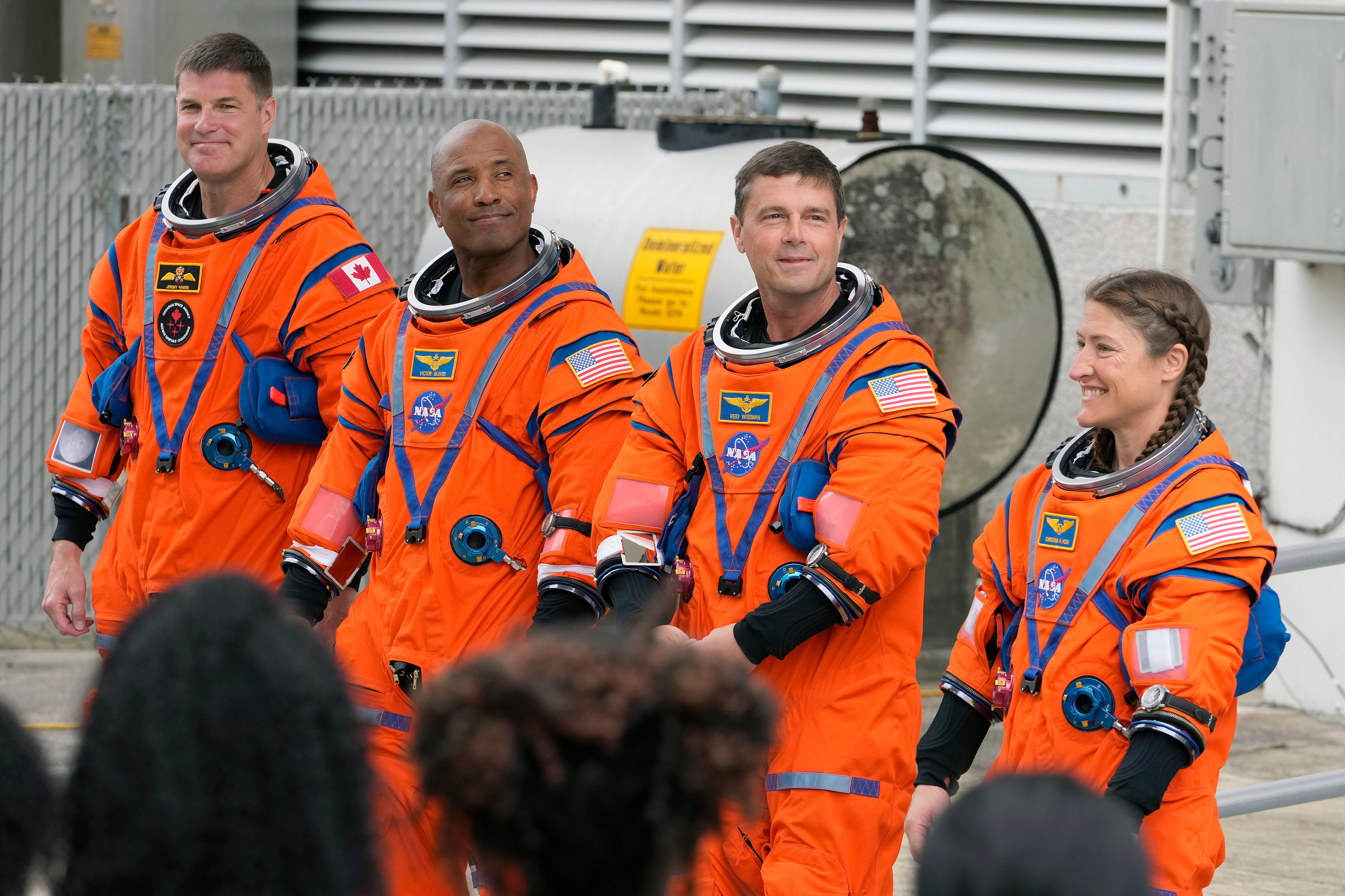 Astronauts, from left, Mission Specialist Jeremy Hansen, of Canada, Pilot Victor Glover, Commander Reid Wiseman, and Mission Specialist Christina Koch pose for a photo after leaving the Operations and Checkout Building for a trip to Launch Pad 39-B and a planned liftoff on NASA's Artemis II moon rocket at the Kennedy Space Center Wednesday, April 1, 2026, in Cape Canaveral, Fla.
