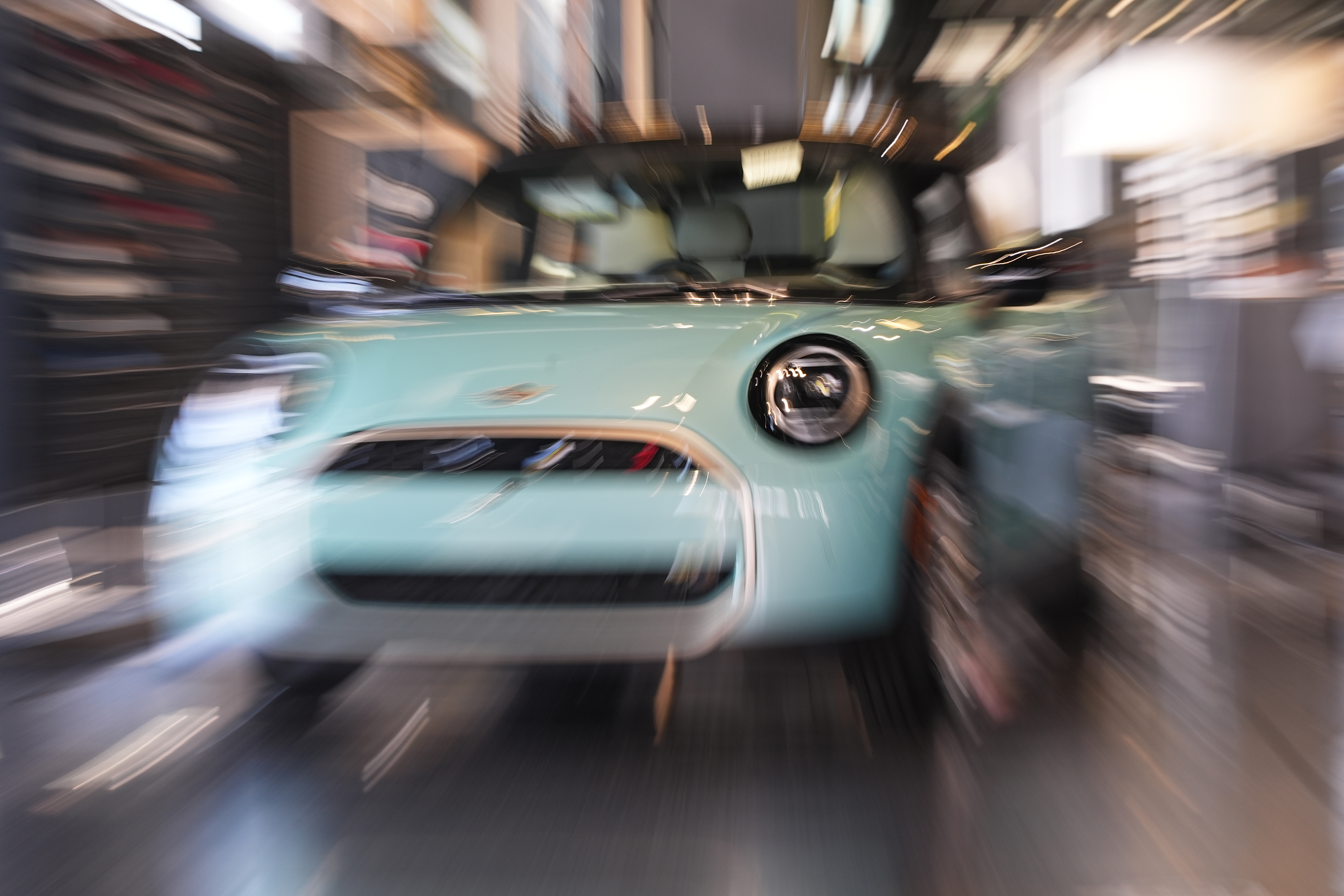 Made with a slow shutter speed and zoom lens, an unsold 2026 Cooper S hardtop is diplayed in a Mini dealership Friday, Oct. 24, 2025, in Highlands Ranch, Colo.