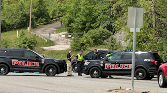 Police block a road near a chemical plant where a leak occurred Wednesday, April 22, 2026, in Institute, W.Va.